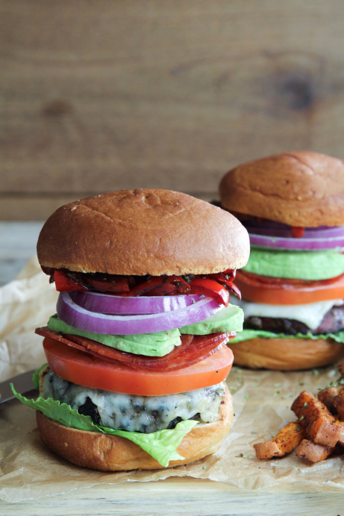 A mouthwatering grass-fed Italian Club Burger topped with goat cheddar, balsamic peppers, lettuce, onion, tomato and avocado: Jessi's Kitchen