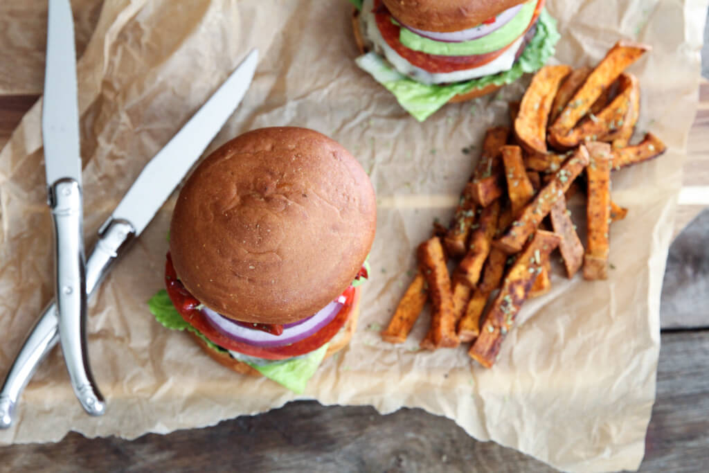 A mouthwatering grass-fed Italian Club Burger topped with goat cheddar, balsamic peppers, lettuce, onion, tomato and avocado: Jessi's Kitchen