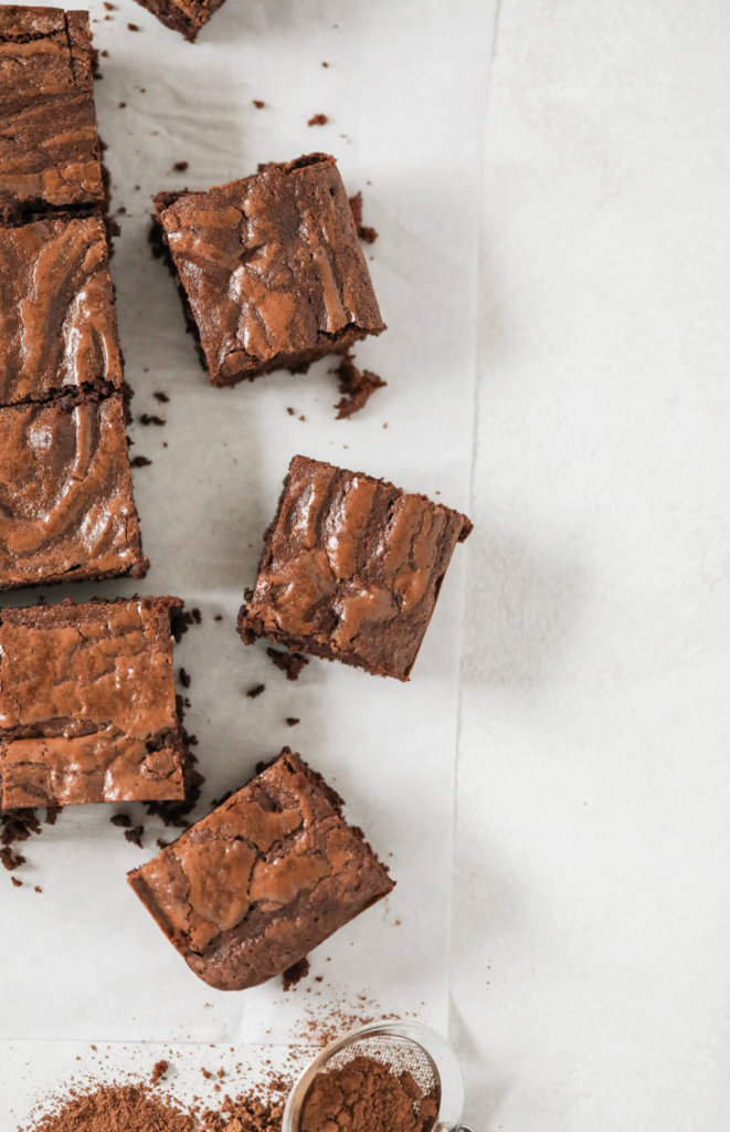 A top down view of some scattered, fudgy oat brownies.