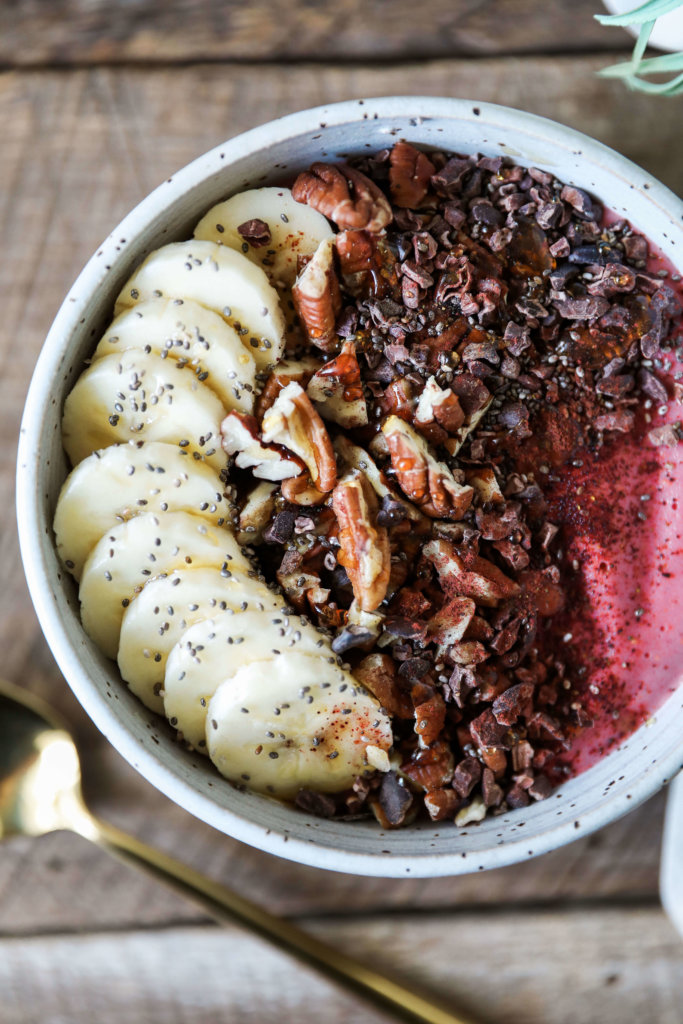 A 5-minute nutritious smoothie bowl with frozen raspberries and bananas. Topped with fruit, nuts and seeds for a healthy snack: Jessi's Kitchen