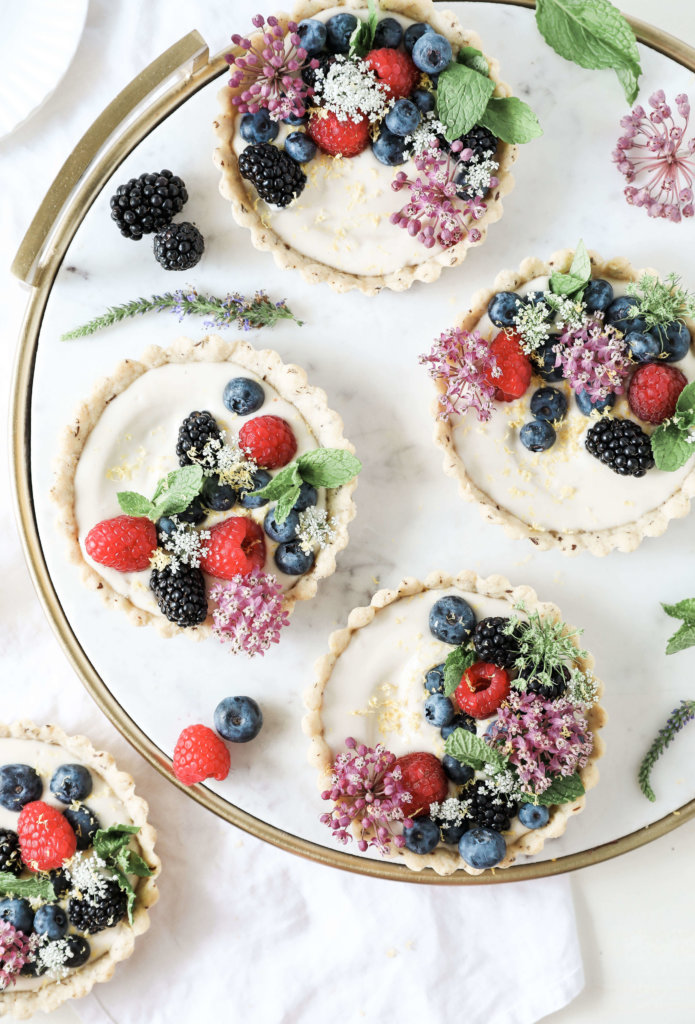 Sweet almond tarts filled with creamy, cashew based cheesecake and topped with an assortment of fresh berries: Jessi's Kitchen