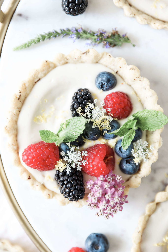 Sweet almond tarts filled with creamy, cashew based cheesecake and topped with an assortment of fresh berries: Jessi's Kitchen