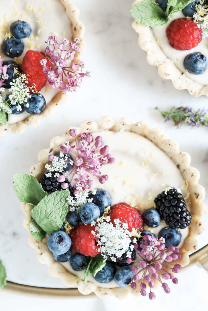 Sweet almond tarts filled with creamy, cashew based cheesecake and topped with an assortment of fresh berries: Jessi's Kitchen