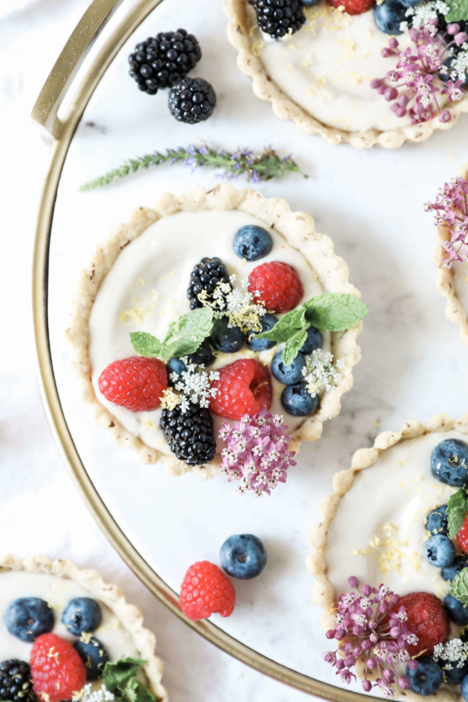 Sweet almond tarts filled with creamy, cashew based cheesecake and topped with an assortment of fresh berries: Jessi's Kitchen